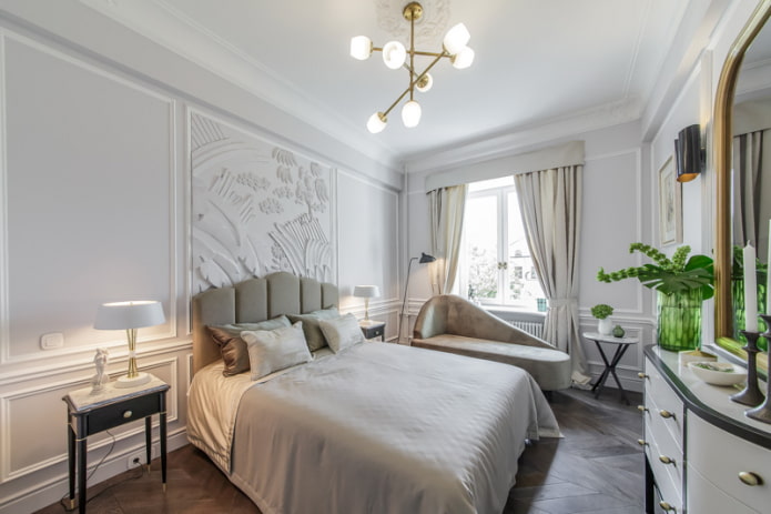 chandelier above the bed in the bedroom interior