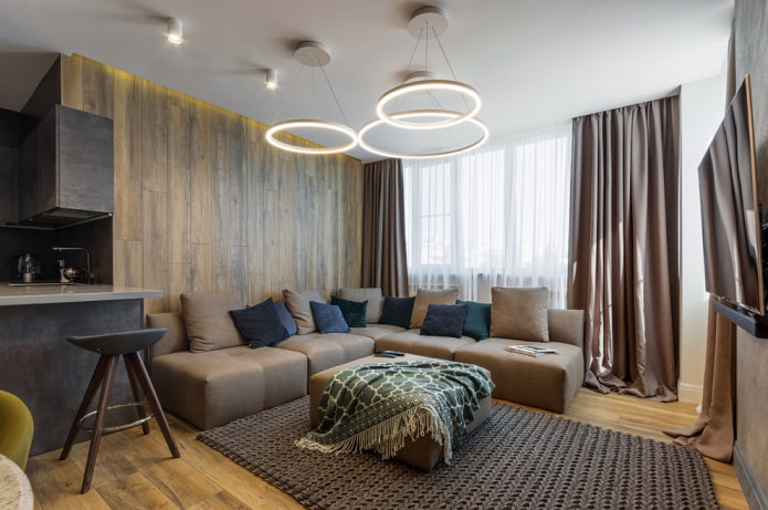 chandelier above the sofa in the living room interior