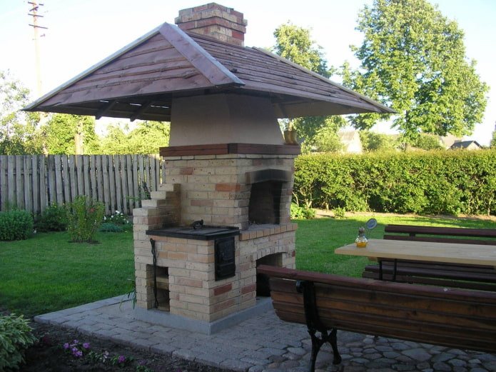 barbecue with a wooden canopy