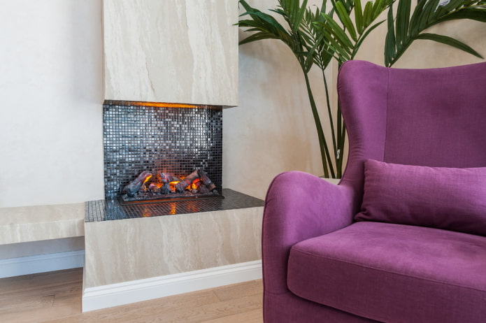 mosaic on the fireplace in the living room interior