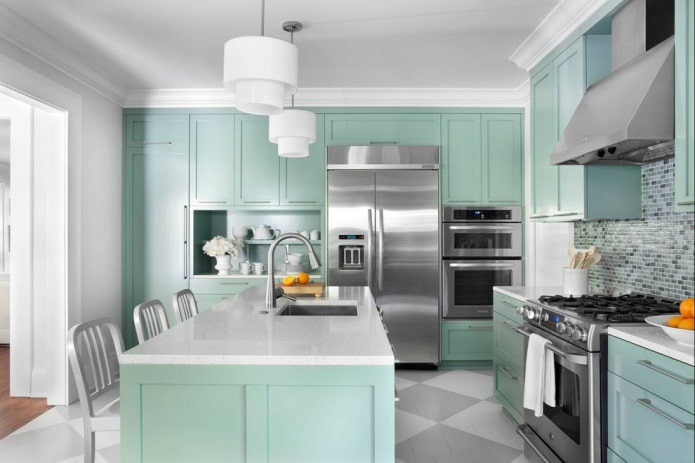 interior of a modern island kitchen in mint tones