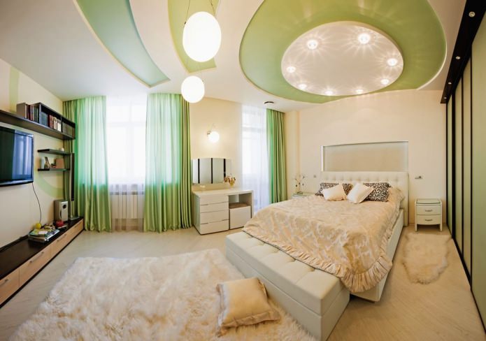 two-level stretch ceiling in a white and green bedroom