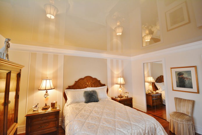Glossy stretch ceiling in the bedroom