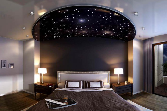 stretch ceiling in the bedroom with lighting 