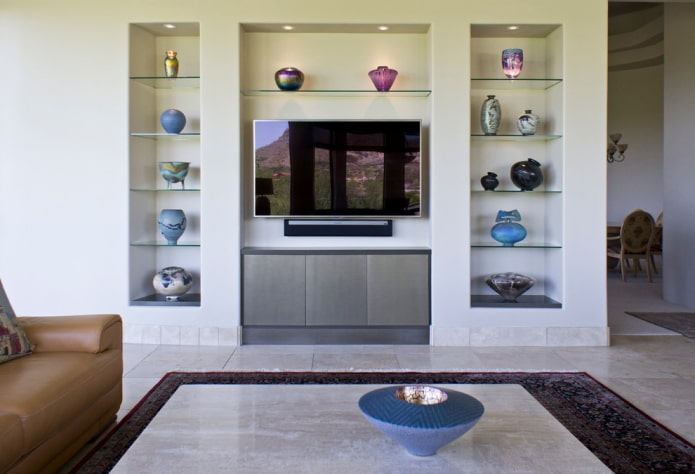 TV in a niche with shelves in the interior