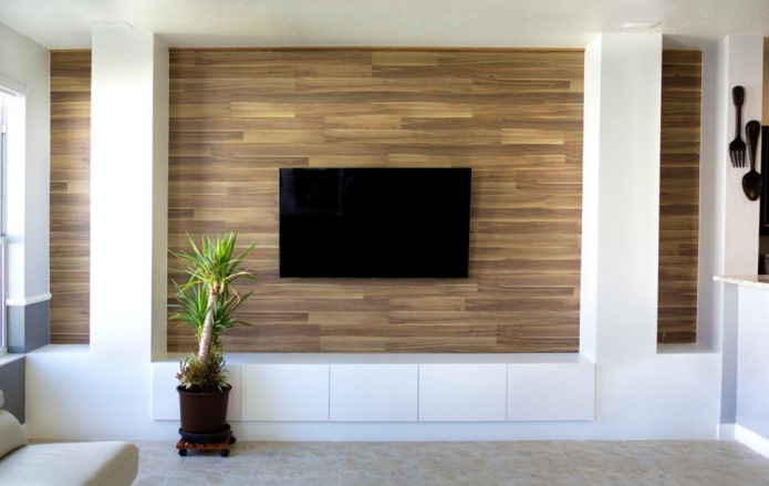 TV in a niche made of laminate in the interior