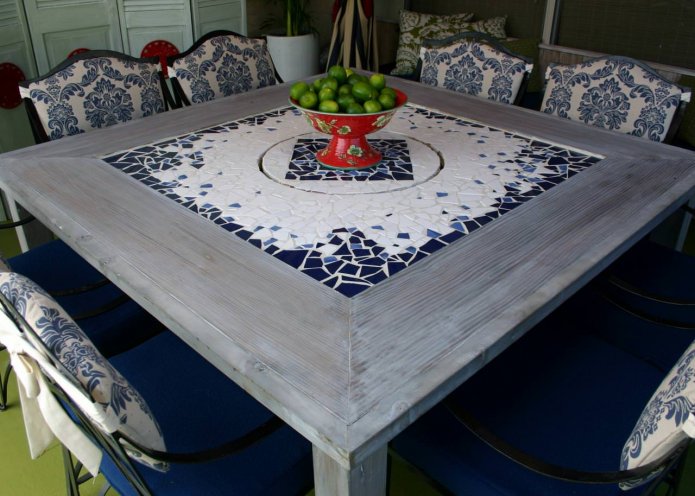 table with a mosaic countertop in the kitchen interior