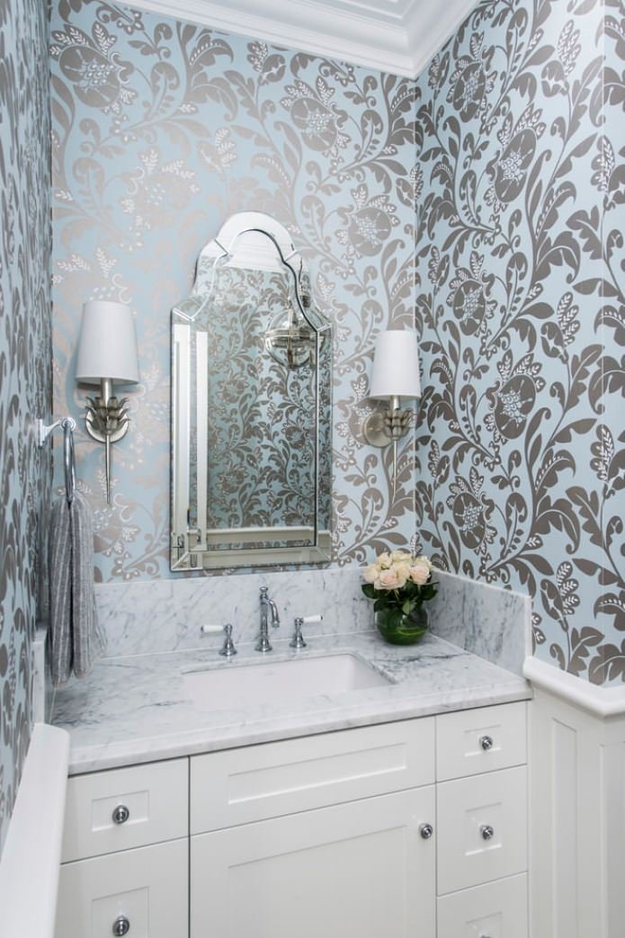 blue wallpaper with a pattern in the bathroom