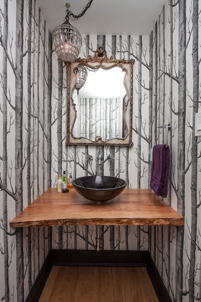 wallpaper with images of trees in the interior of the bathroom