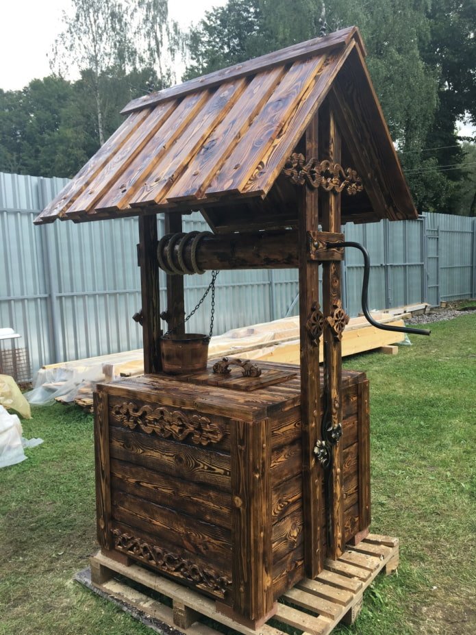 burnt well with carved decorations