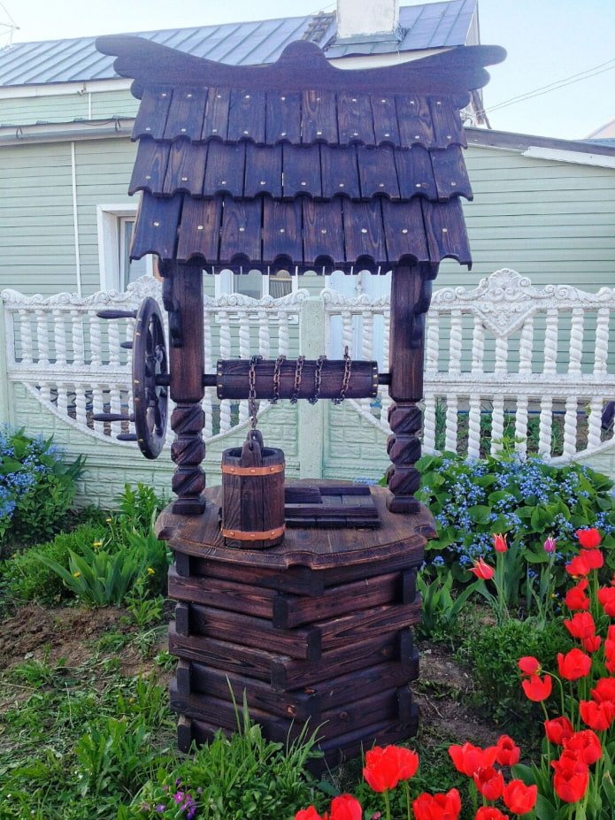 well with a bucket made of charred wood