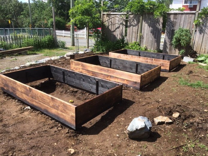 beds made of burnt boards