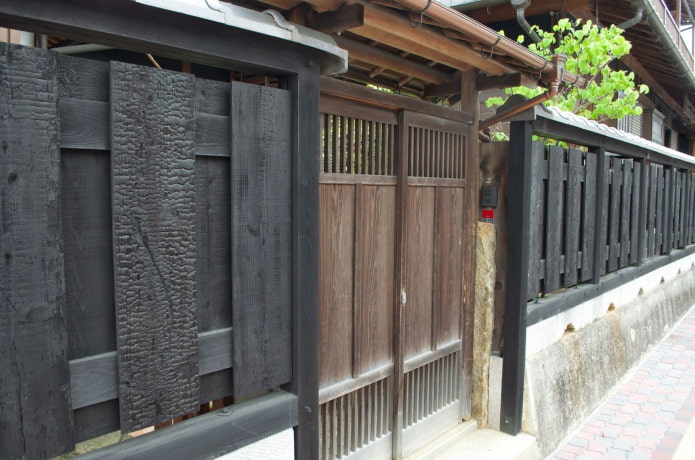 fence and gate made of burnt board