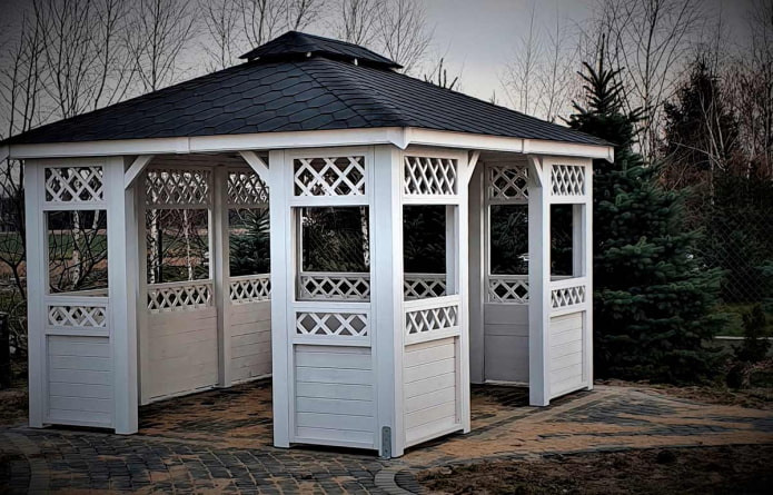gazebo made of white clapboard with slat decor