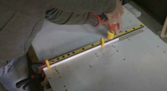 making holes for the shelves