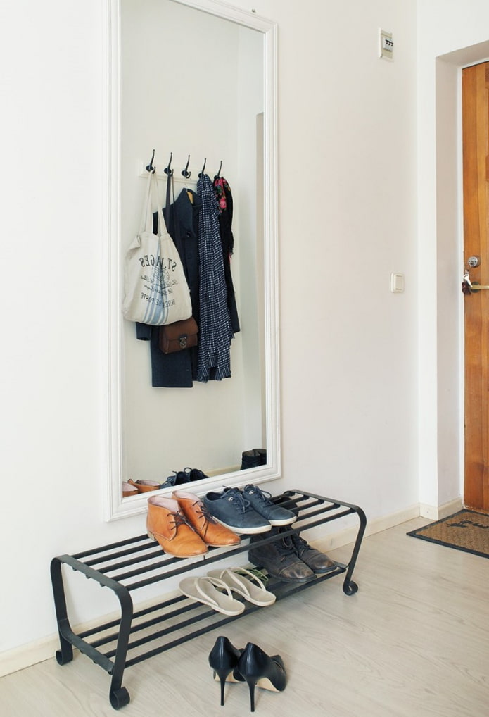 metal shoe rack in interior of the hallway