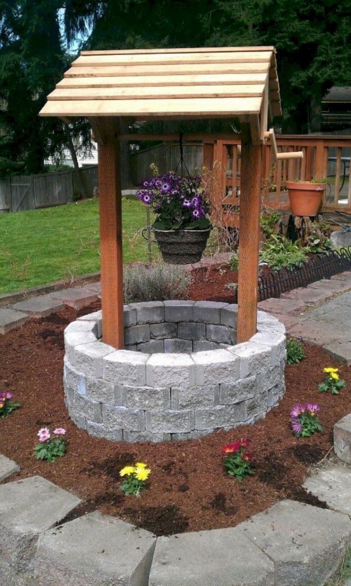 fake well on the septic tank hatch