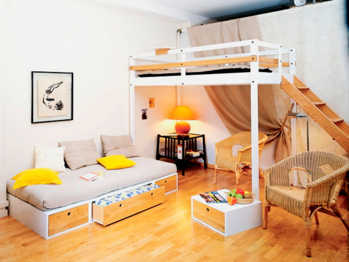 bed on the second tier in a studio apartment