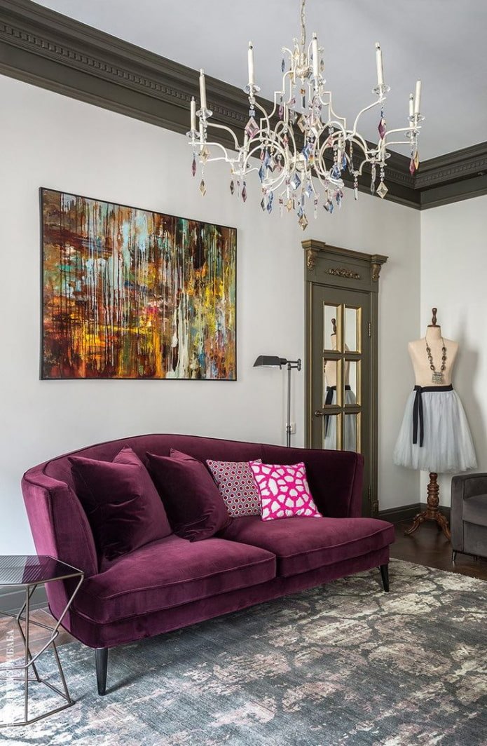 colored painting above the sofa