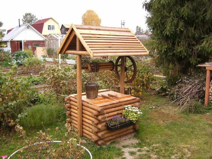 wooden well with a steering wheel