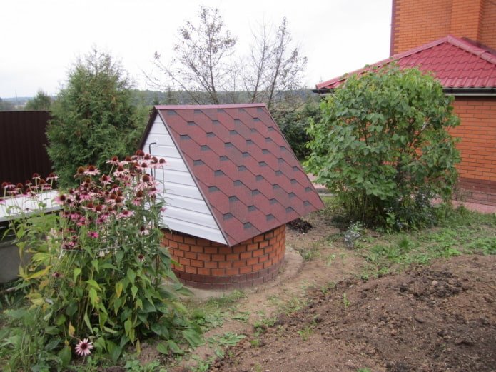 brick well with a roof