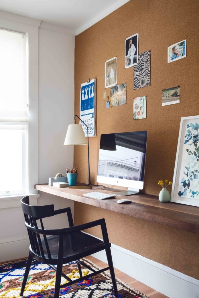 photos on a cork board in the interior