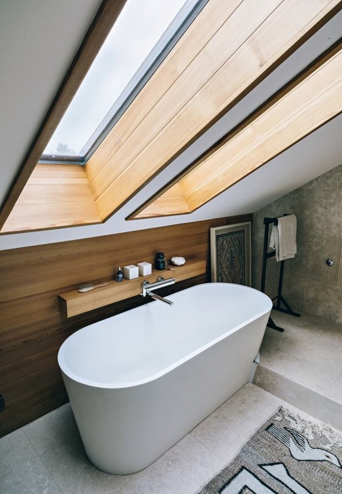 wooden slopes in the attic bathroom