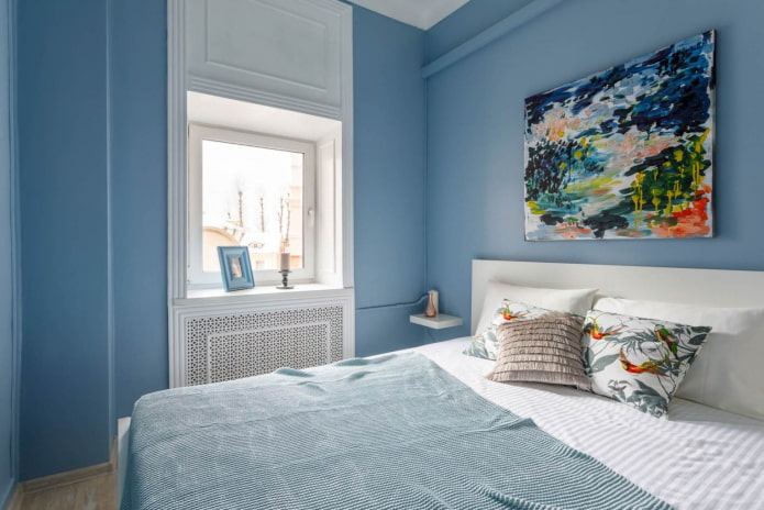 white window group with moldings in a blue bedroom