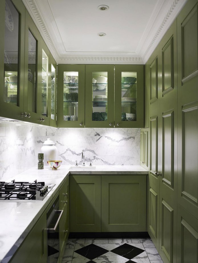 white countertop in a green kitchen
