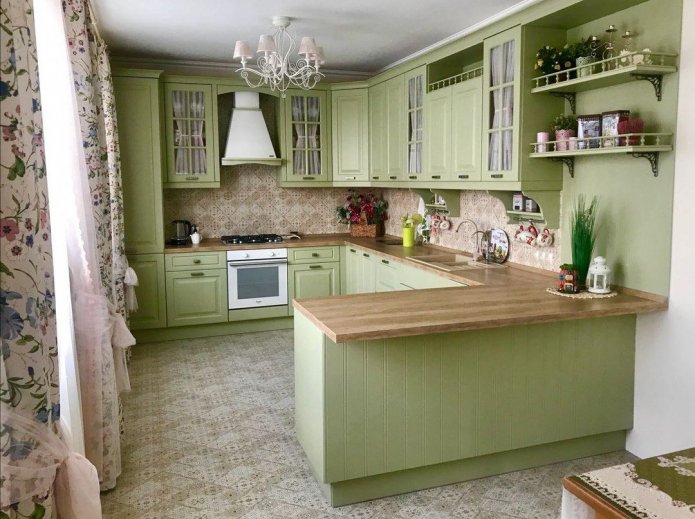 olive kitchen with a wooden countertop