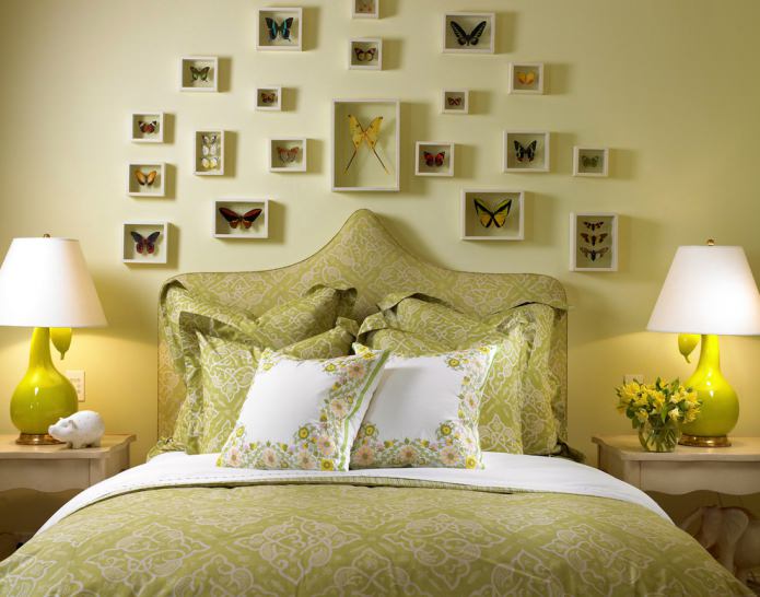 butterflies in frames on a light green wall