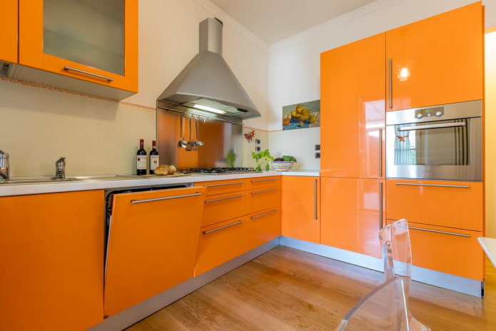furniture and appliances in the kitchen interior in orange tones