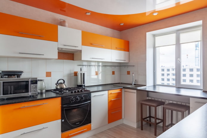 curtains in the kitchen interior in orange tones