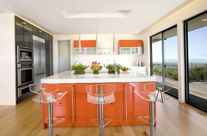 furniture and appliances in the kitchen interior in orange tones