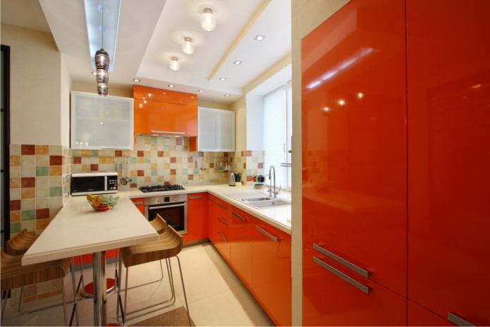 furniture and appliances in the kitchen interior in orange tones