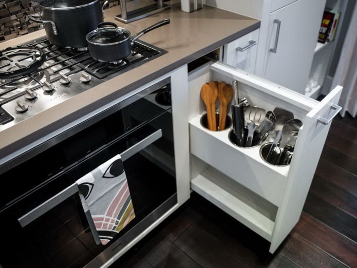kitchen with a convenient design for storing utensils