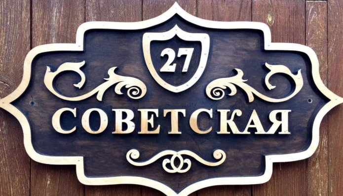 House sign with curls