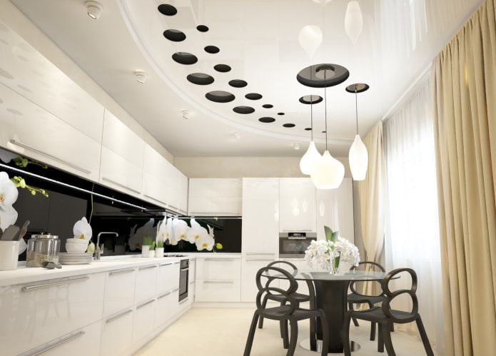 stretch ceiling with a chandelier in the kitchen interior