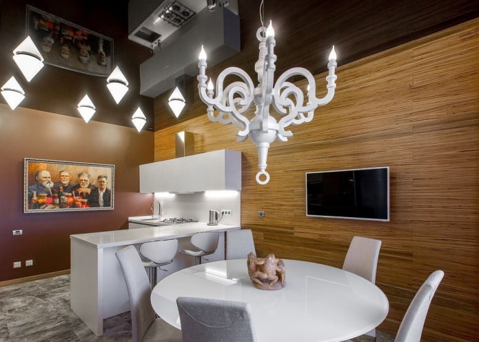 stretch ceiling with a chandelier in the kitchen interior