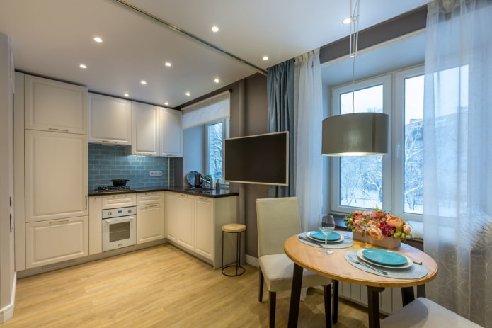 spotlights on a stretch ceiling in the kitchen interior