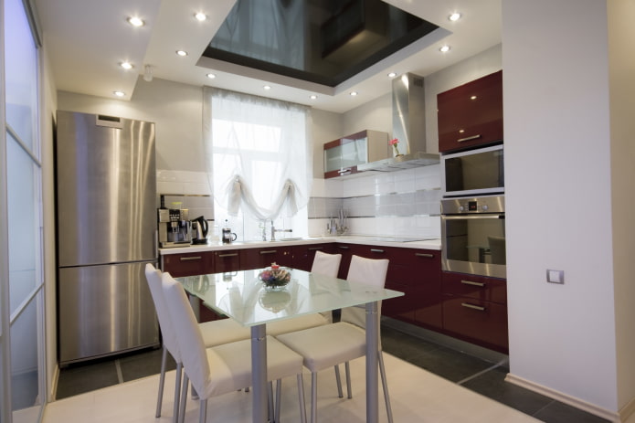 Lighting of a stretch ceiling in the interior of a small kitchen