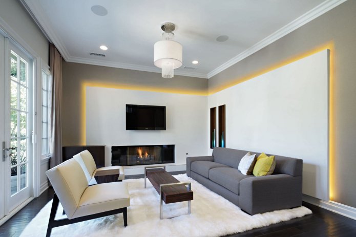 living room with a fireplace and armchairs
