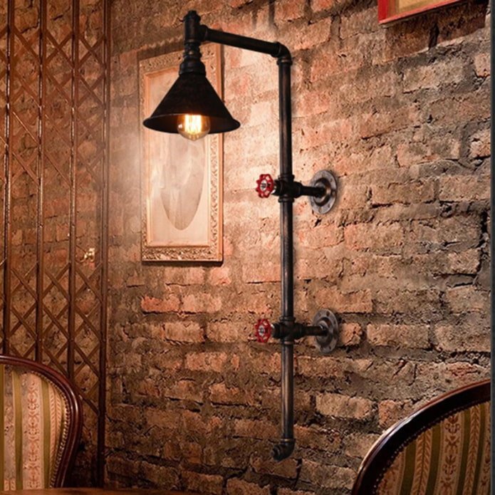 Wall lamp made of pipes in an industrial style