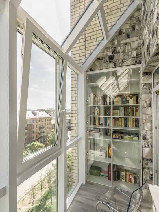 Balcony with gray stone and panoramic windows