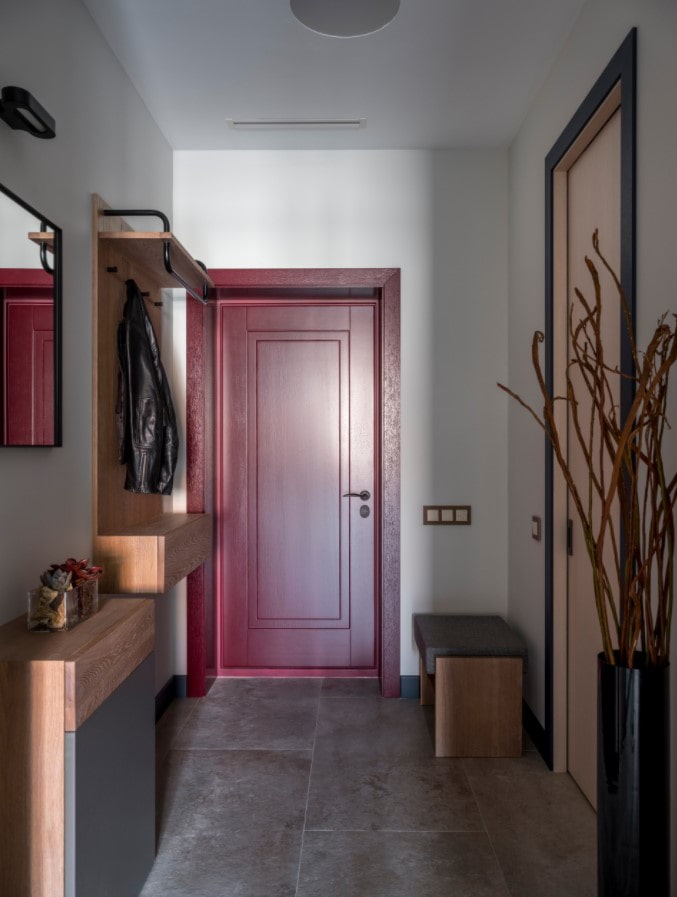 hallway with a red door