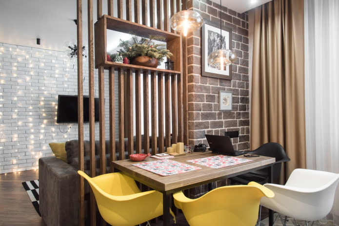 wooden partition in the interior of the kitchen-living room