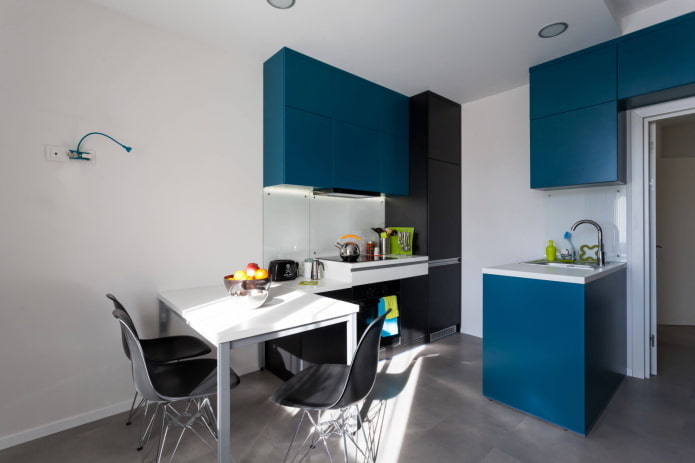 Studio kitchen with an island-sink