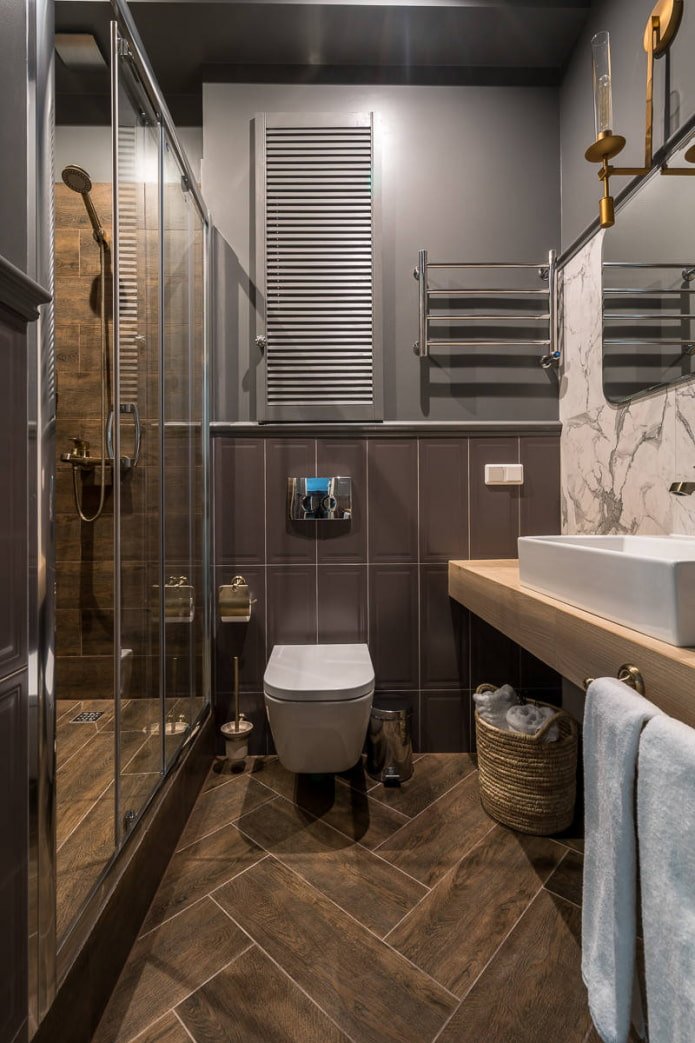 Tiles in the shower, mirror and toilet area