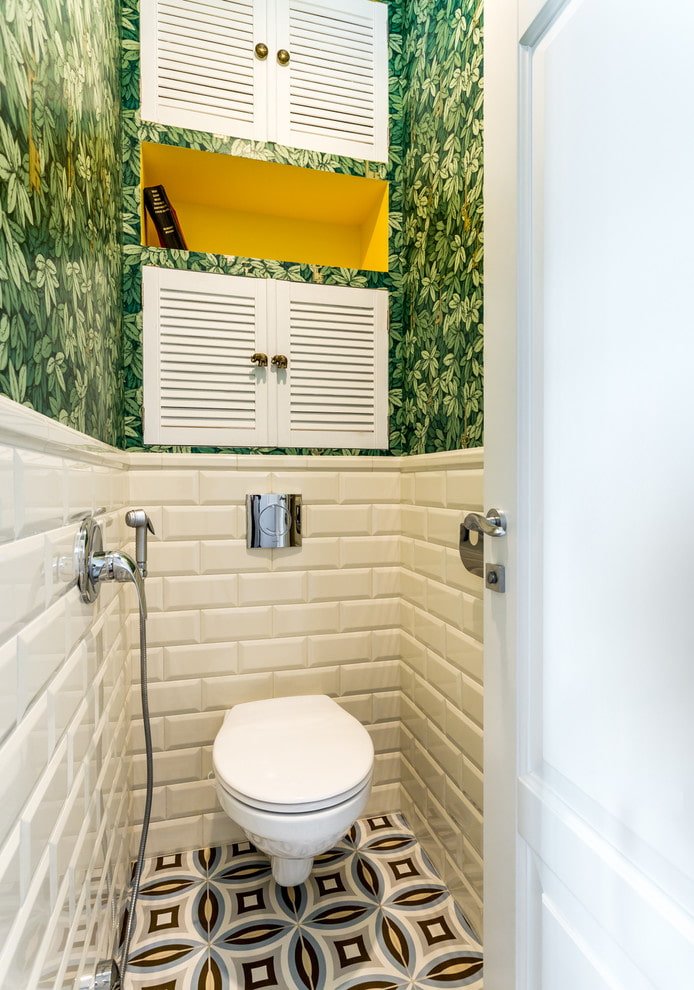 plumbing fixtures in the interior of a toilet in a Khrushchev-era apartment