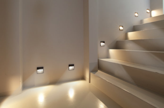 stairs with wall lamps in the house